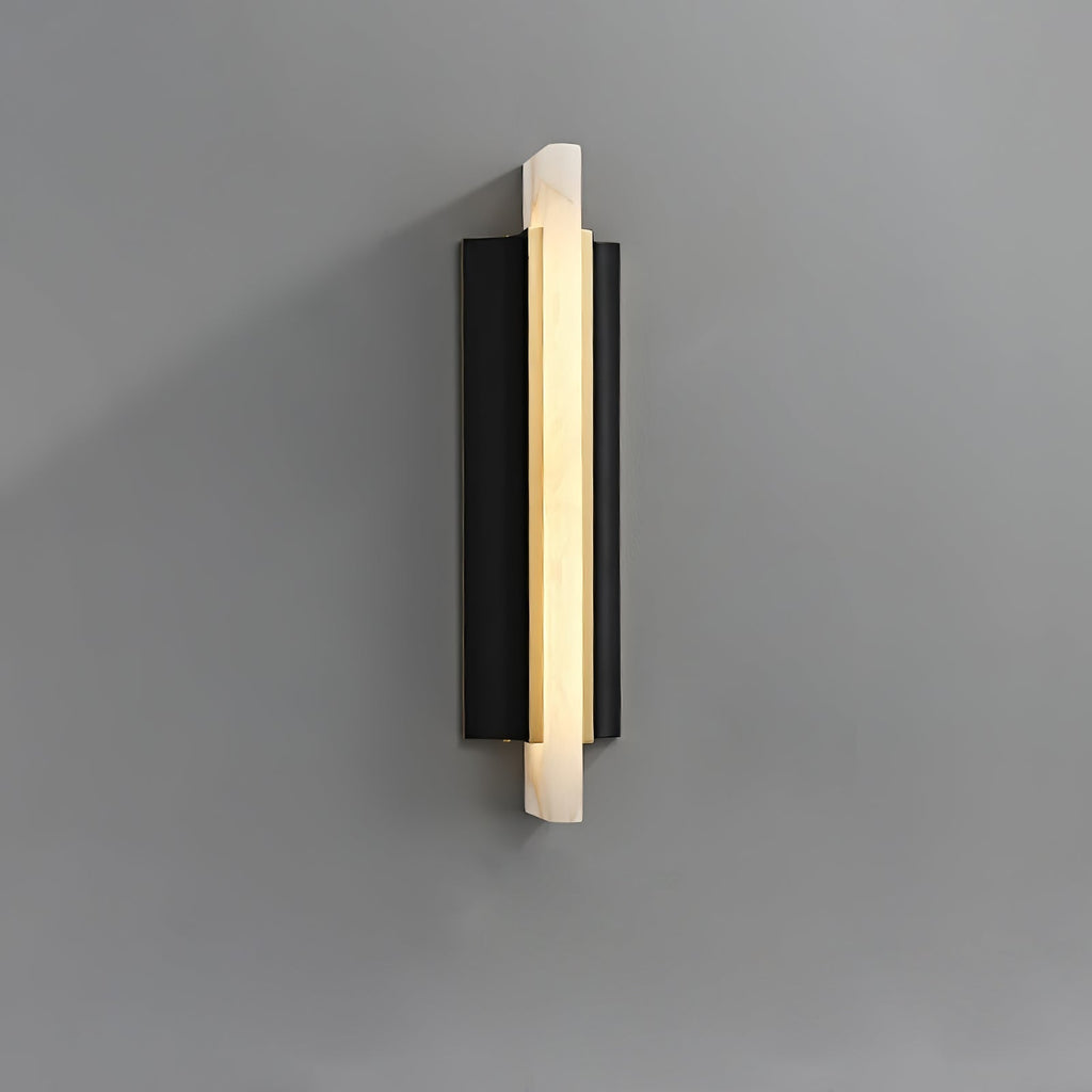 The light on grey seen straight on, alabaster blade centred on the black panel.