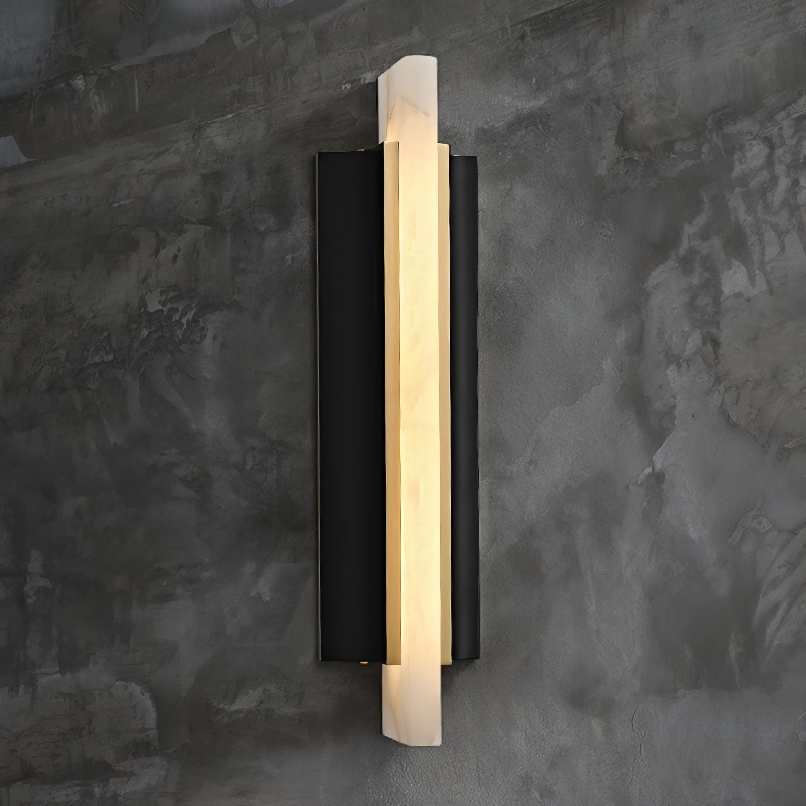 The light lit against a textured concrete wall, its alabaster blade glowing warm.