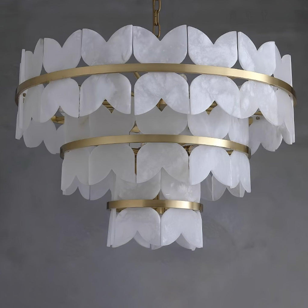 Three tiers on grey, viewed slightly from below so the lamps inside are visible.