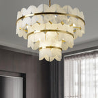 Lit in a room with dark panelling and long curtains, the tiers glowing warm.