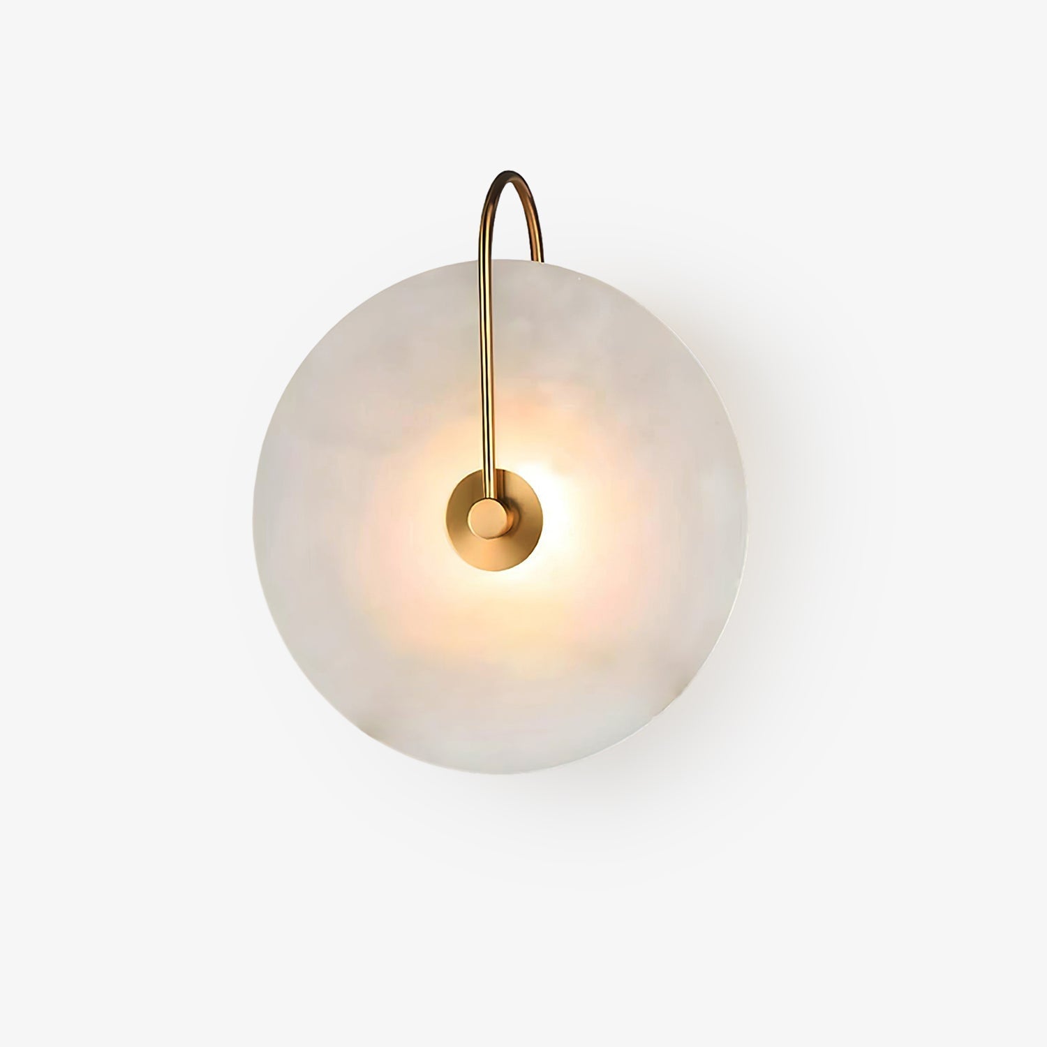 Kristy wall lamp photographed on white, the arched brass arm hooking over the top of the lit disc.