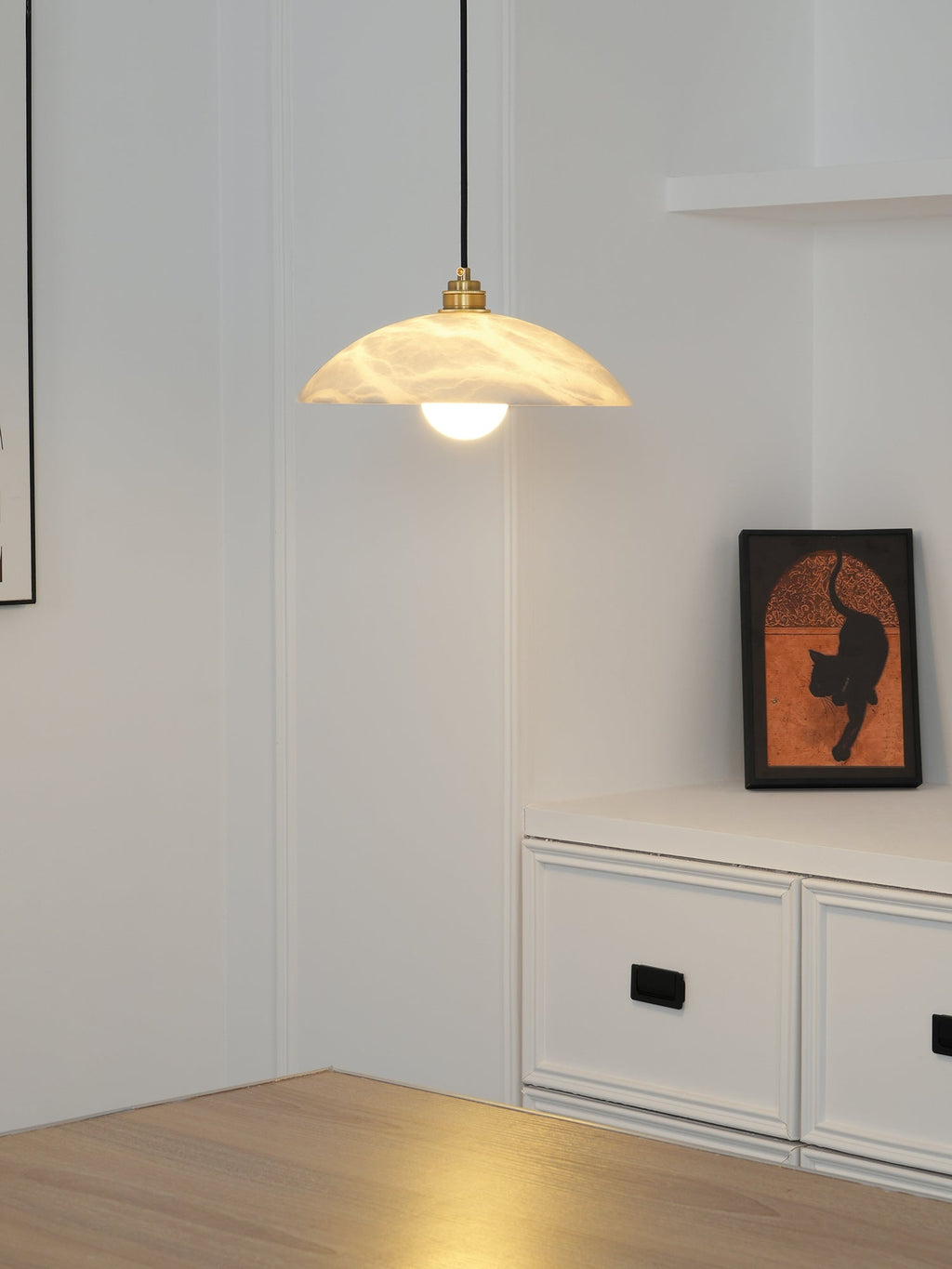 White alabaster pendant showing unique stone veining and brass fitting