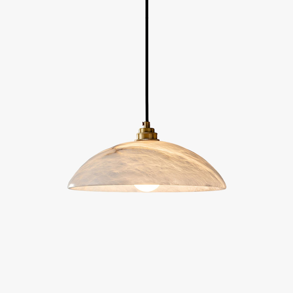 Genuine alabaster dome pendant with brass fitting over a kitchen island