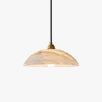 Genuine alabaster dome pendant with brass fitting over a kitchen island