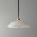 Slim alabaster dome pendant light hanging close to the ceiling