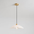 Full drop of the Nerea pendant with its clear filament bulb switched on beneath the dome.