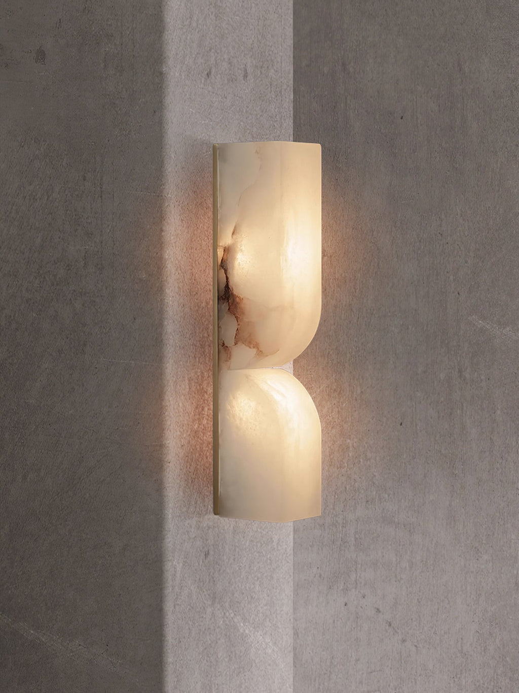 Solid alabaster sconce with black finish and soft warm light