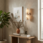 Twin alabaster column light glowing softly in a styled room