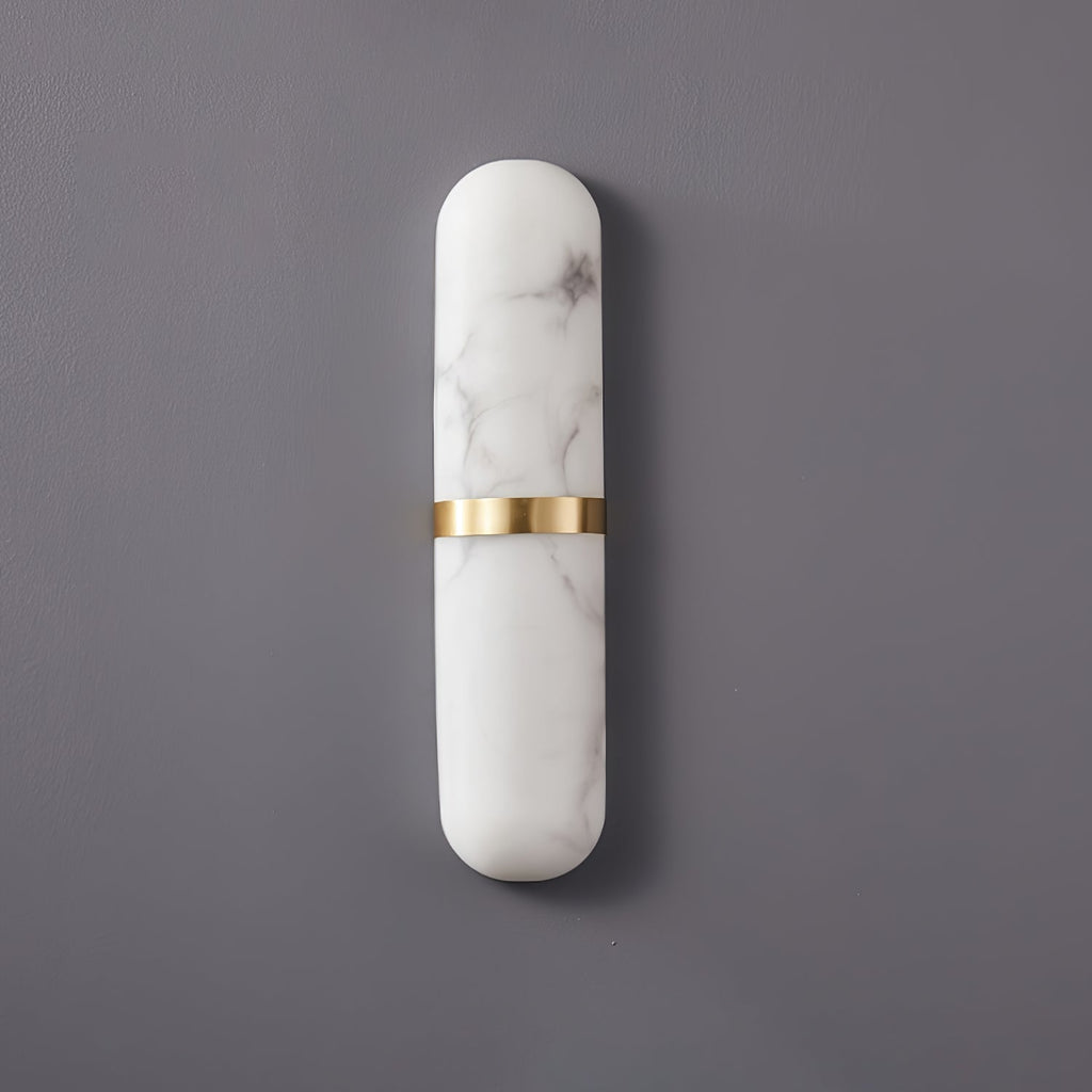 Clérachic slim alabaster wall lamp with polished brass band, unlit, grey-black veining on a grey wall