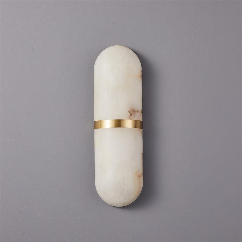 Clérachic brass-banded alabaster wall lamp in the wider size, straight-on studio view on a light grey wall