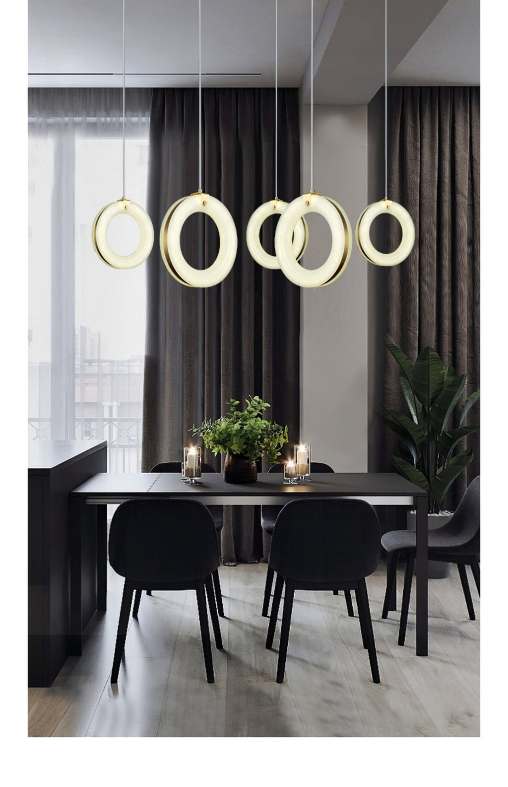 Tall view of the five-pendant row over a black dining table with chairs and pale wood floor