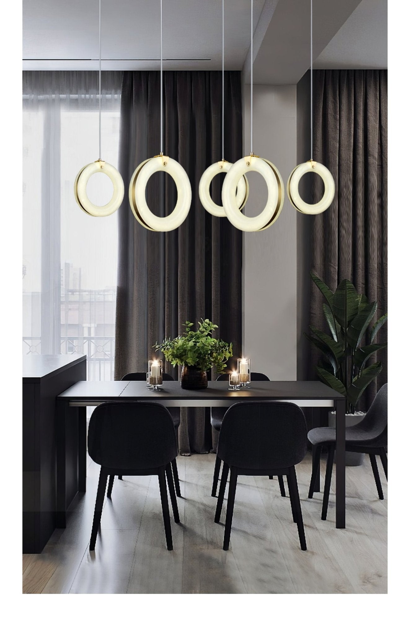 Tall view of the five-pendant row over a black dining table with chairs and pale wood floor