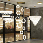 Alabaster ring pendants arranged as a long cascade in a lighting showroom window display