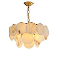 Two-tier alabaster chandelier on white, overlapping round stone discs hung from a brass chain.