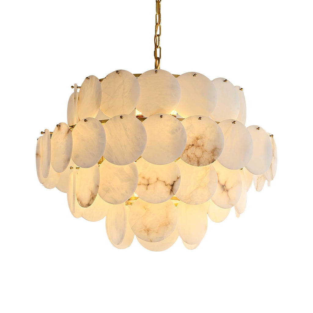 The three-tier version lit, the discs' veining showing warm against the pale stone.