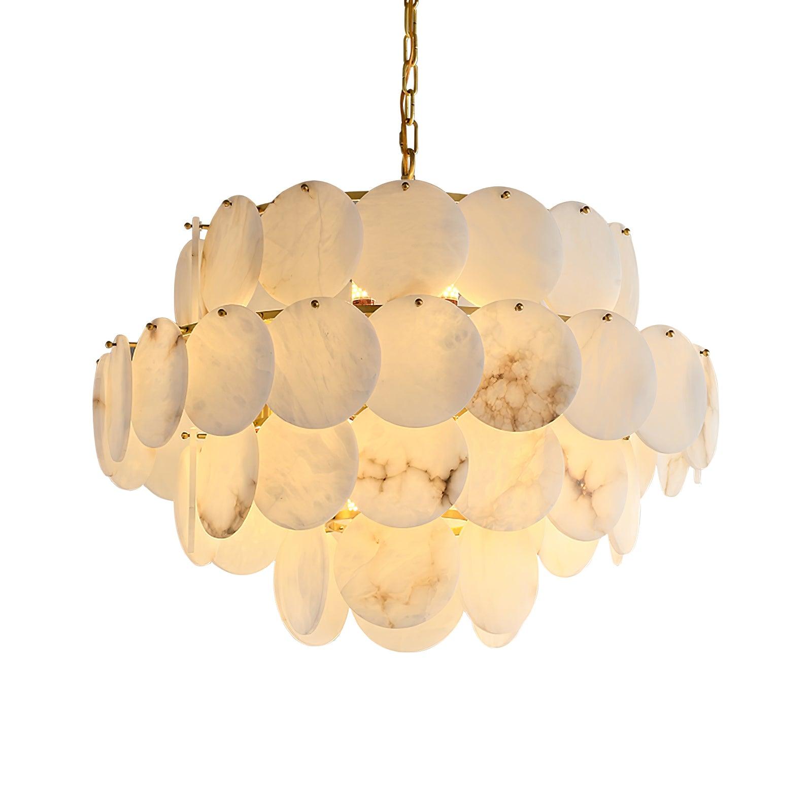 The three-tier version lit, the discs' veining showing warm against the pale stone.