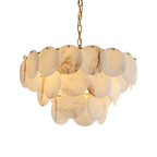 The two-tier version lit on white, light glowing through the layered alabaster discs.