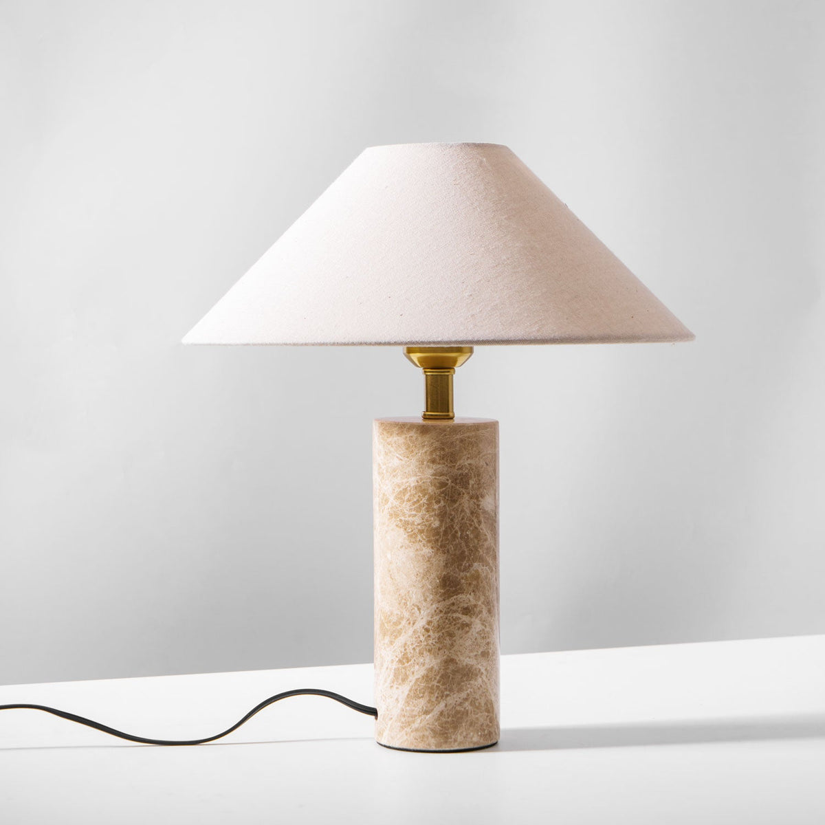 A similar studio shot of the unlit Clérachic table lamp seen from a slightly different angle.