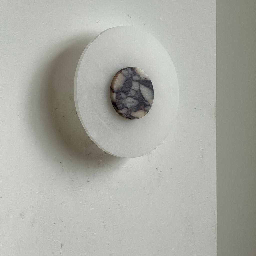 Clérachic side angle of the unlit Rauduvyi wall lamp showing how shallow the alabaster plate sits on the wall