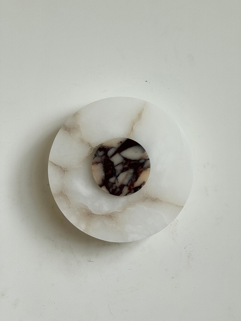Clérachic unlit Rauduvyi wall lamp photographed from the front, warm brown veins running through the alabaster