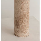Close-up of the marble column alone, showing the Clérachic table lamp base's warm veining with no shade in view.