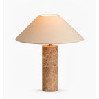 The same low-angle view of the shade underside, this time lit warmly to show the Clérachic table lamp's glow.