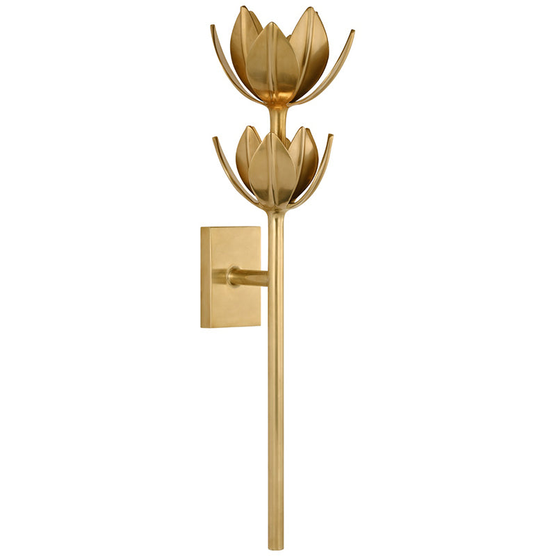 Kristy wall sconce in brass, large size with two tiered blooms above the wall-mounted stem.
