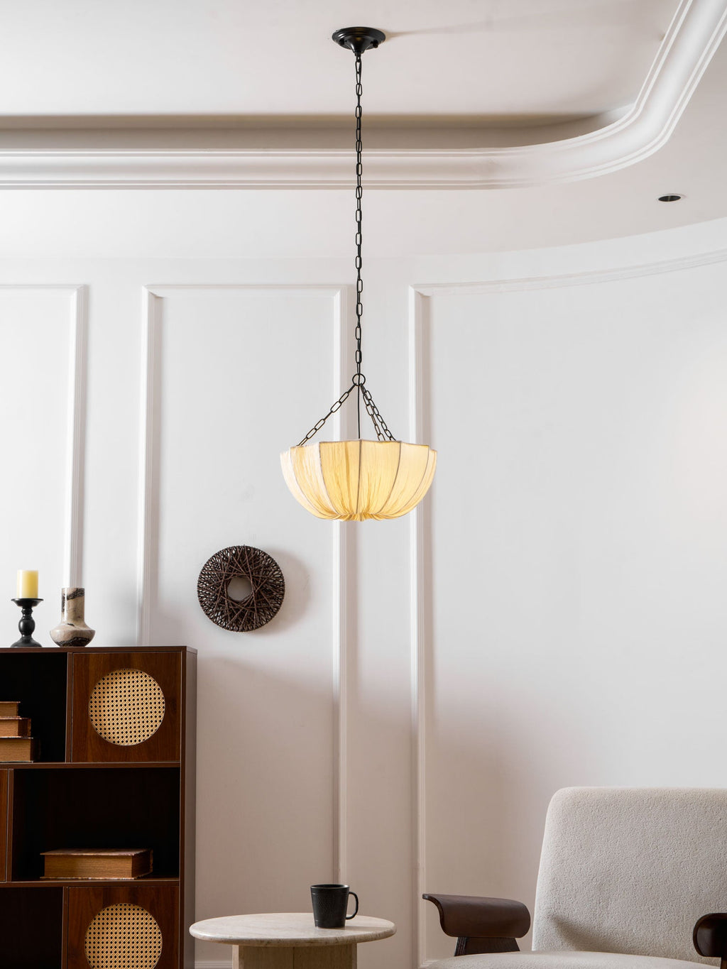 Gathered cotton pendant shade shown close against a wall