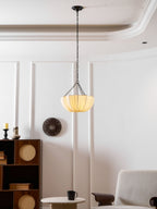 Gathered cotton pendant shade shown close against a wall