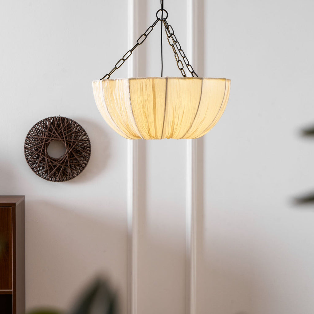 Cotton pendant light with black frame in a styled room