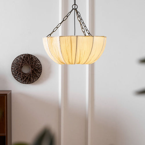 Cotton pendant light with black frame in a styled room