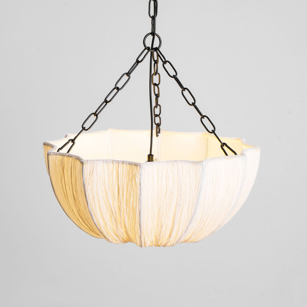 Cotton pendant light shown in a calm neutral room
