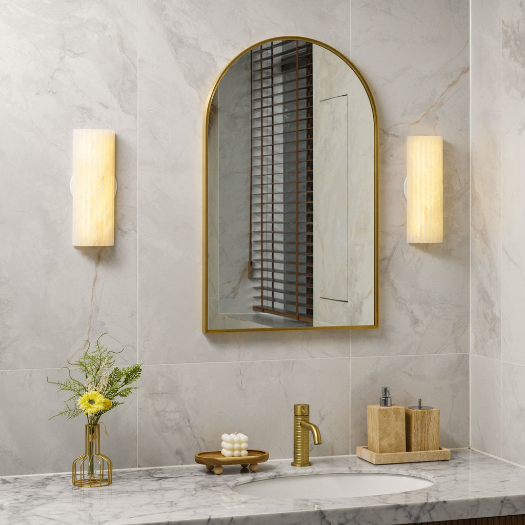 Alabaster wall light mounted on a neutral plaster wall