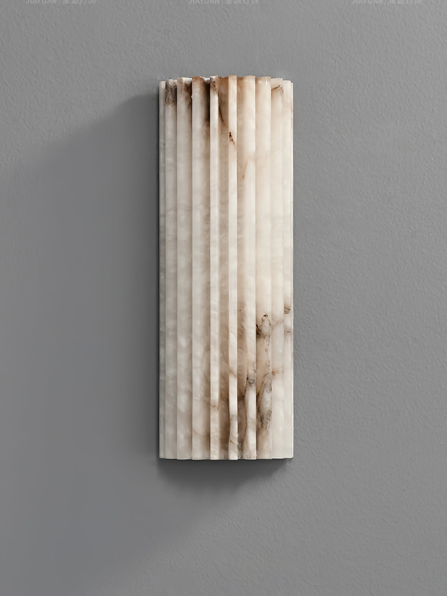 Alabaster wall light shown in a calm bedroom setting
