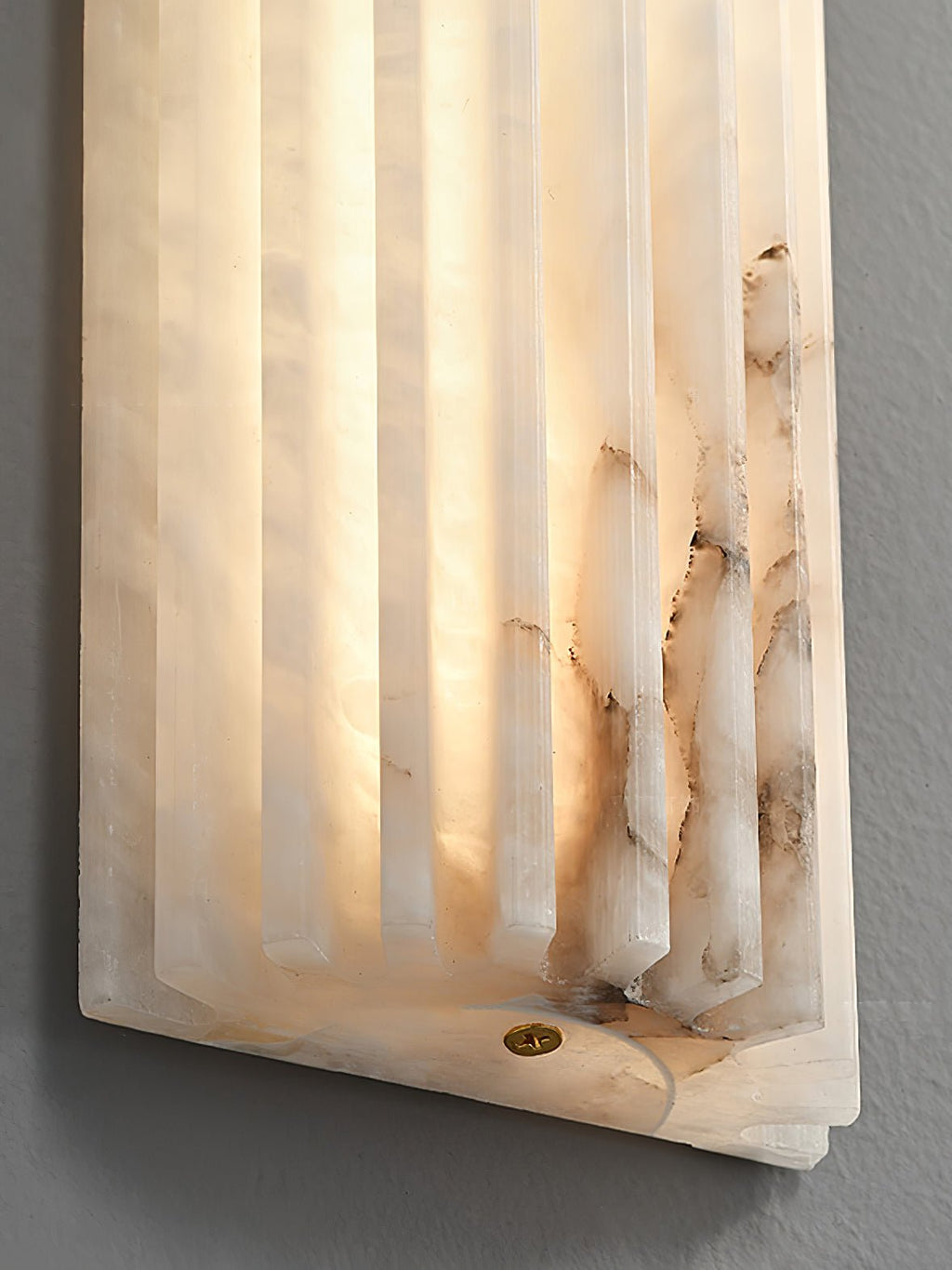Alabaster wall light highlighting natural grain and translucence