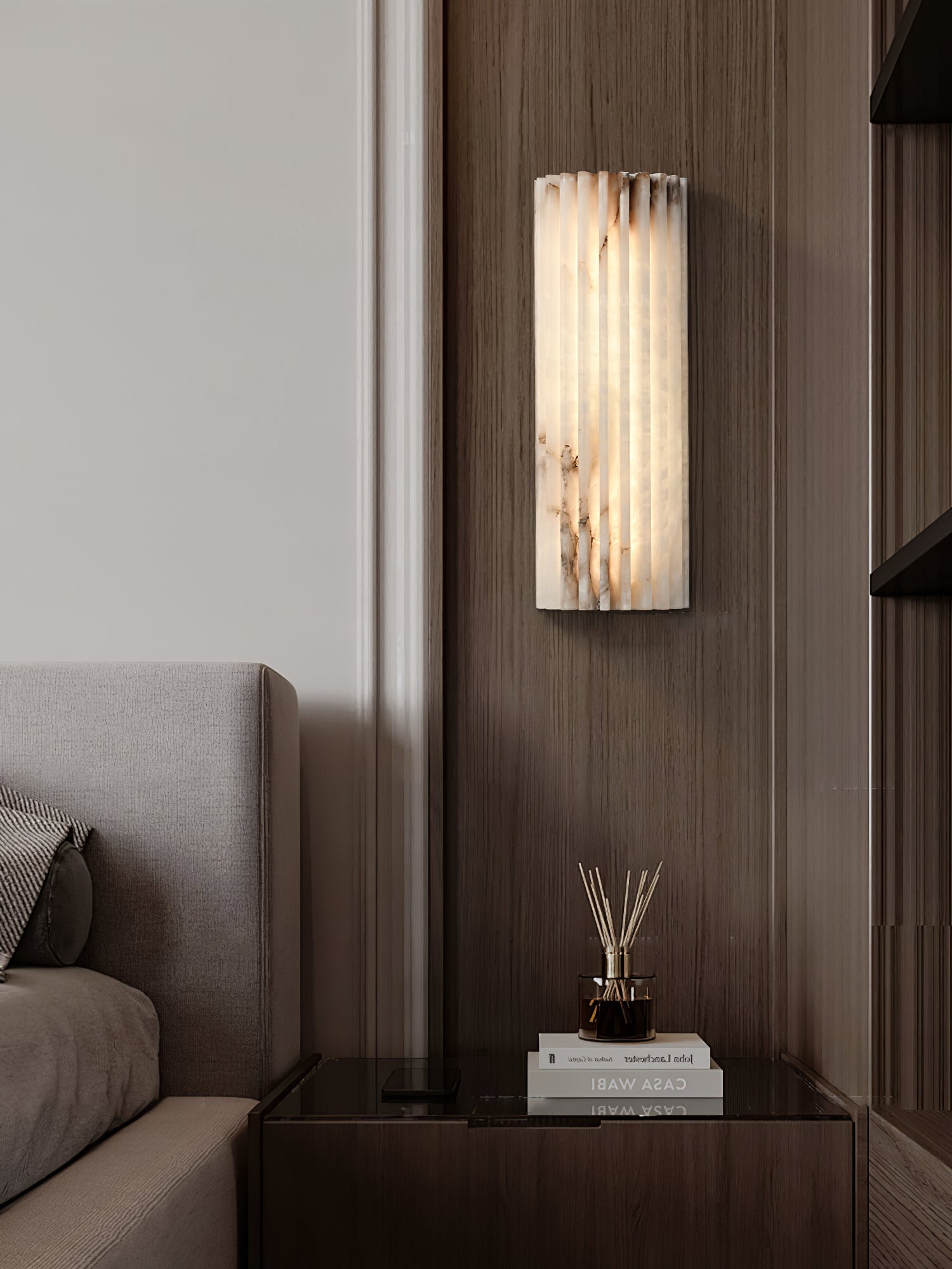 Alabaster wall light close up of carved ribbed surface