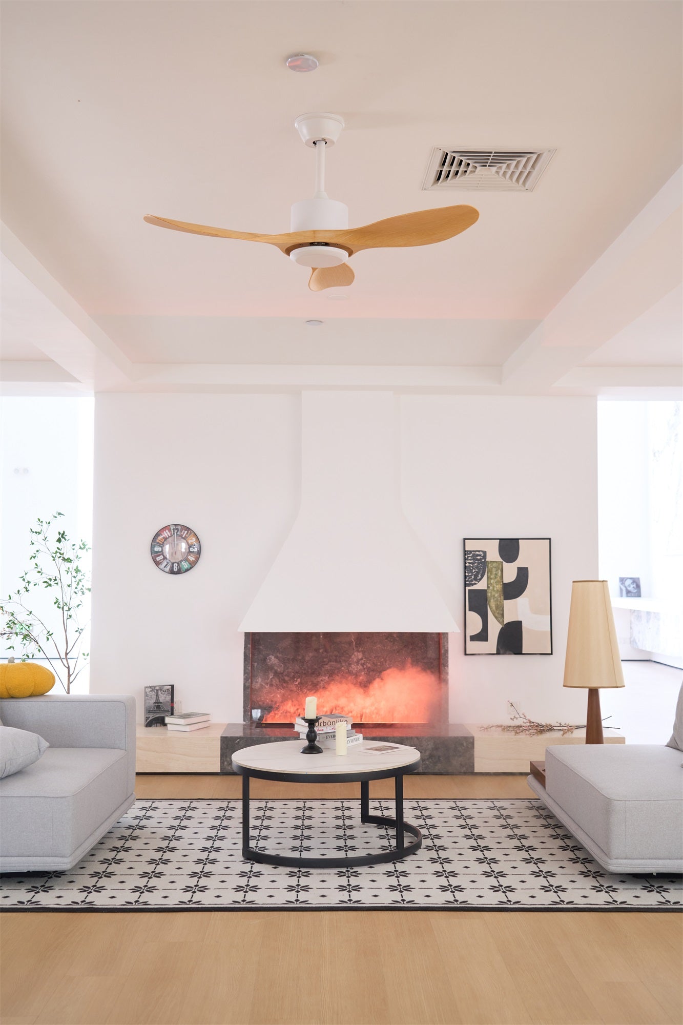 Ceiling fan with walnut blades viewed from the floor