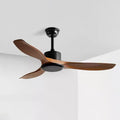 Ceiling fan with curved blades mounted in a bright living room