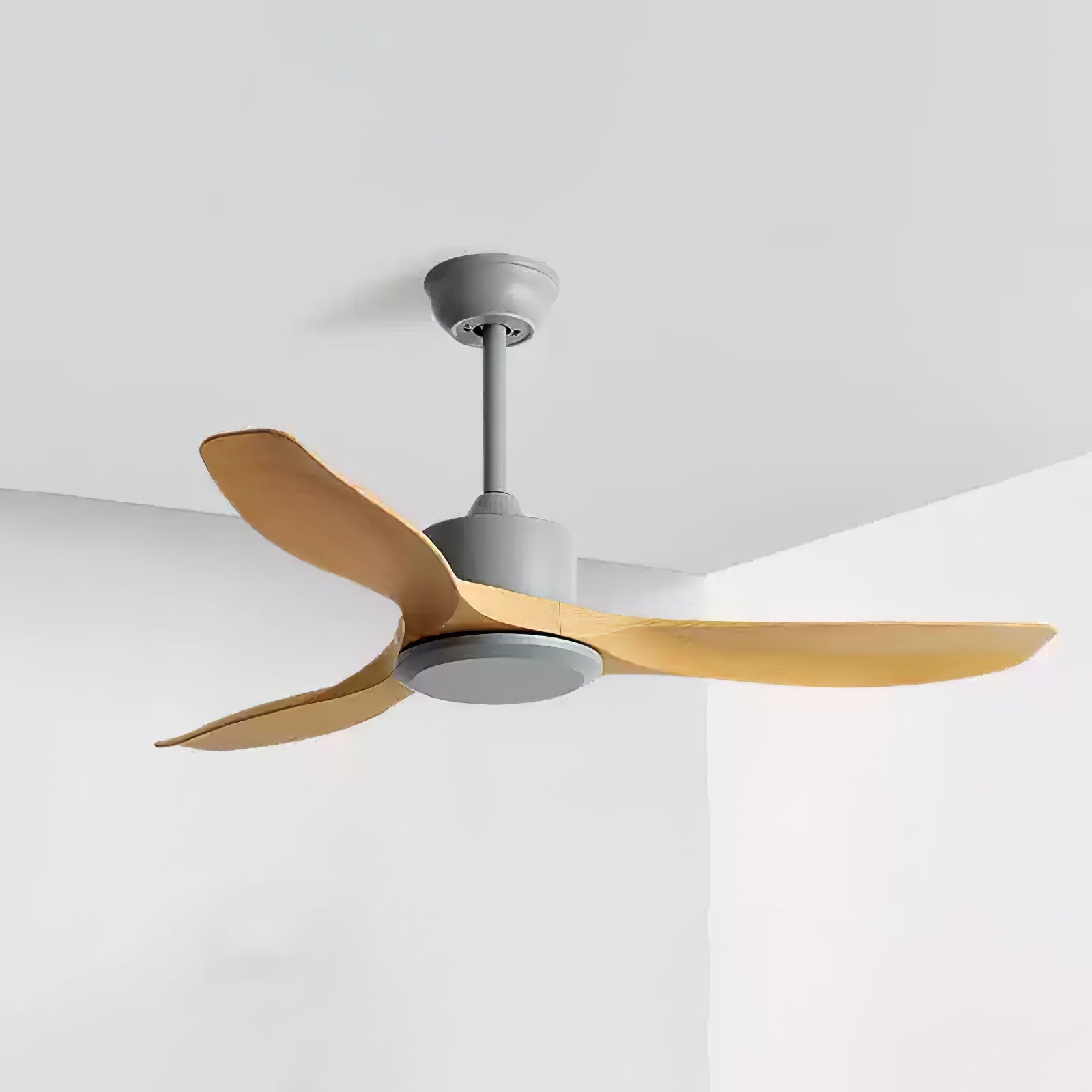 Ceiling fan with sculpted blades shown in a styled interior