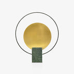 Clérachic table lamp on a green marble base, photographed straight-on against a seamless white studio backdrop.