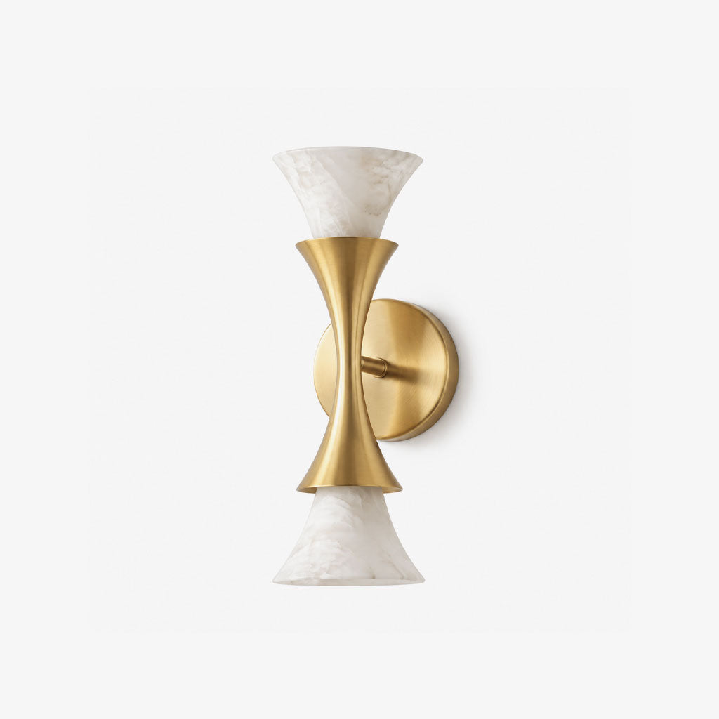Product shot on a plain white background: this Clérachic sconce's brushed brass hourglass center holds two alabaster shades.