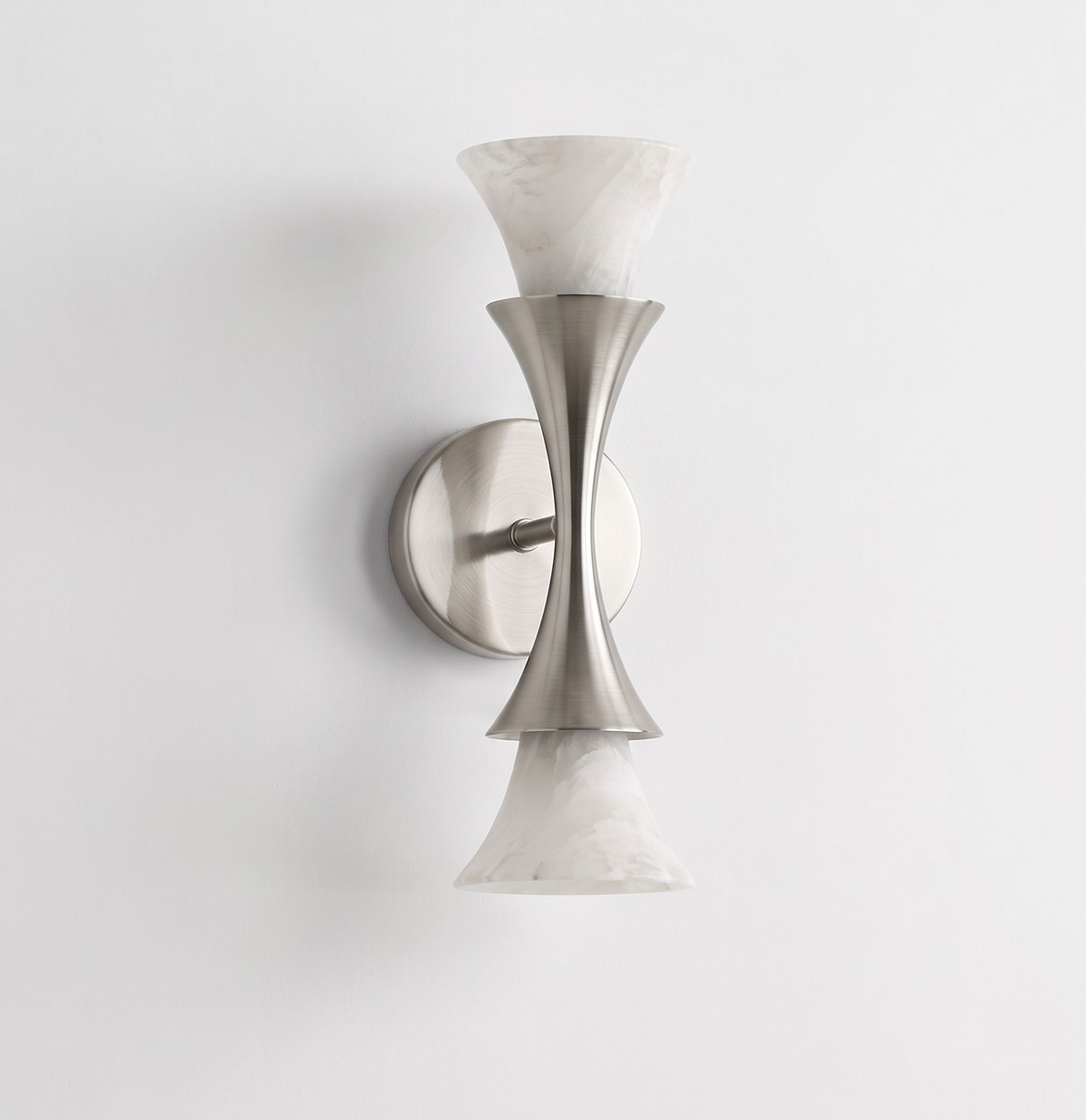 Studio shot against a plain backdrop, this Clérachic sconce shows its brushed nickel finish and upward- and downward-facing shades.