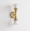 Lit on a plain wall, this Clérachic sconce's brushed brass frame flares to alabaster shades facing up and down.