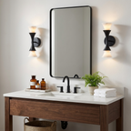 Mounted beside a black rectangular mirror over a dark wood vanity, these Clérachic sconces show a matte black finish.