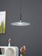 Pendant light shade angled to reveal its interior reflector