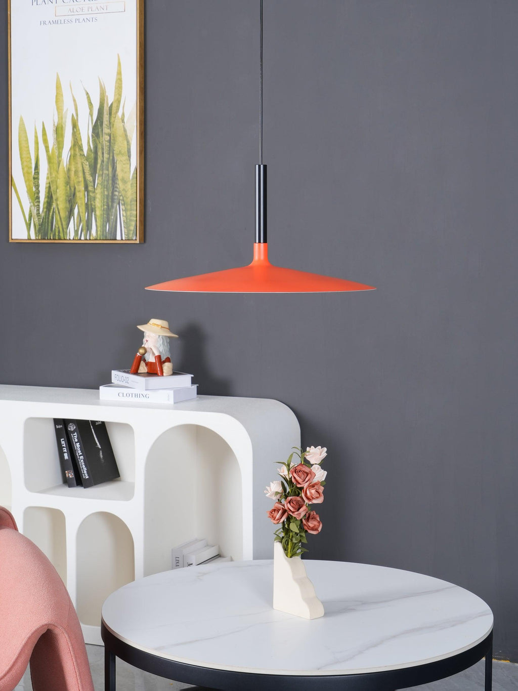 Aluminum pendant lamp shade shown close against a neutral wall
