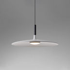 Aluminum pendant light shade hanging over a styled interior setting