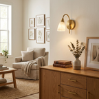 Beside a gallery wall and an oak dresser, this Clérachic sconce's brass arm lights a corner armchair below.