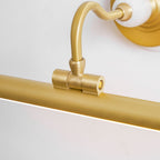 Close view of the curved gold arm and swivel joint connecting to the bar on this Clérachic wall sconce.