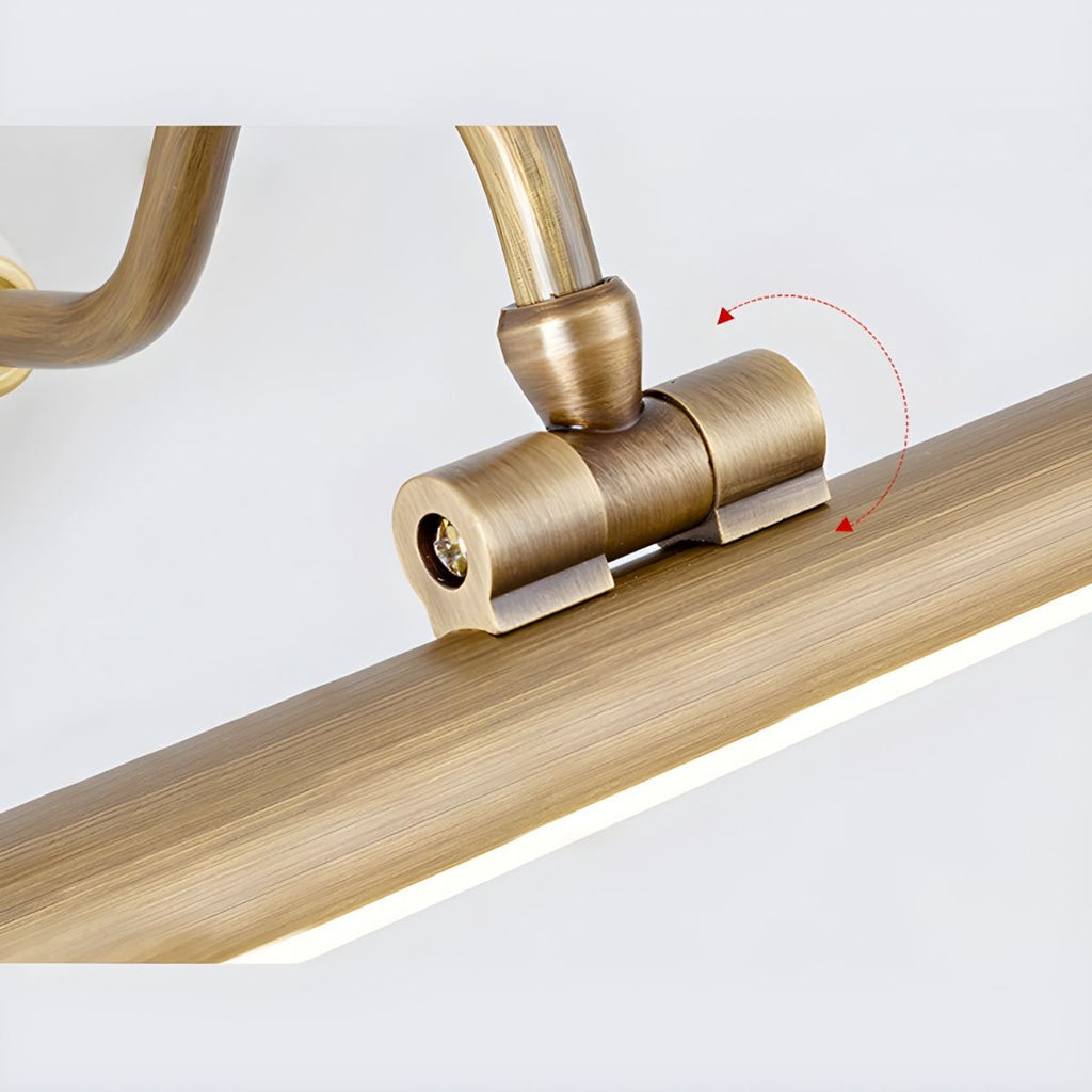 Close view of the adjustable swivel joint on this Clérachic wall sconce, mounted on a wood-toned surface with rotation marked.
